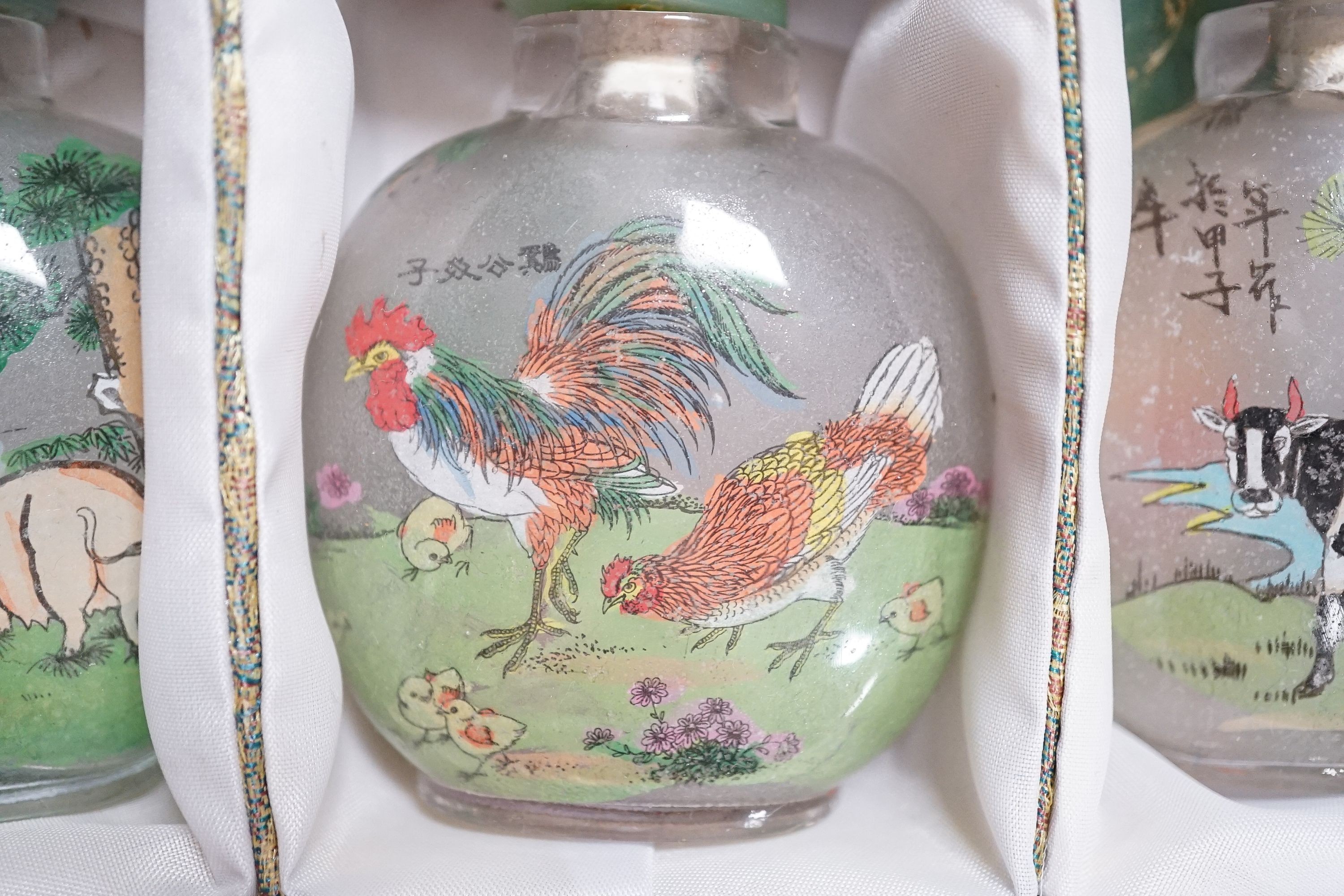 A boxed set of six Chinese inside-painted snuff bottles, height 8cm overall